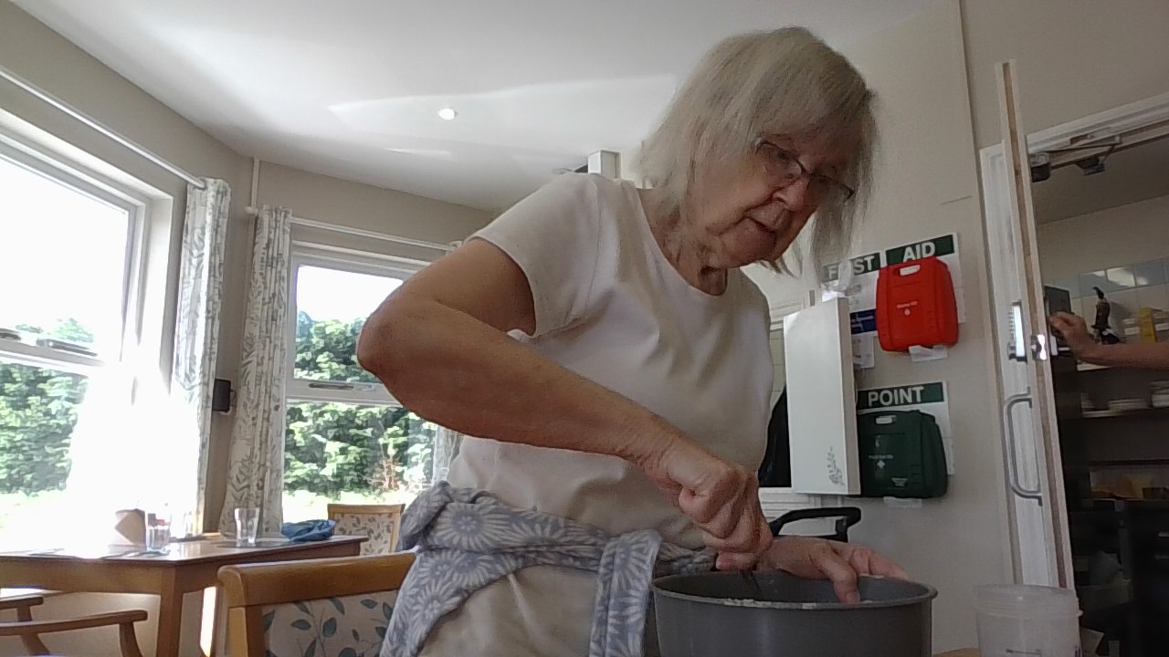 Resident mixing ingredients in a bowl