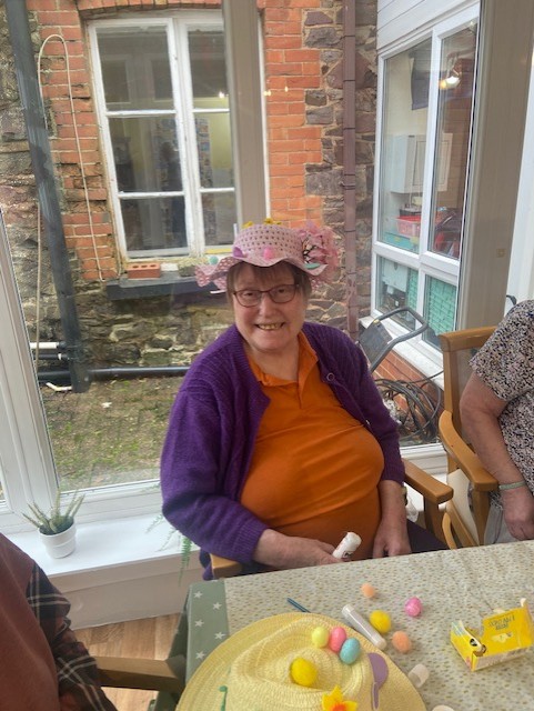 Resident modelling their homemade Easter bonnet
