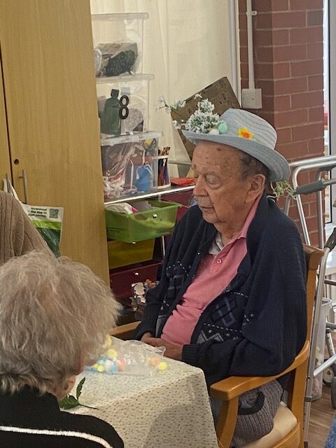 Resident modelling their homemade Easter bonnet