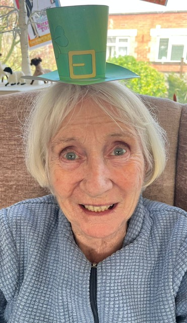 Resident wearing homemade leprechaun hat 8