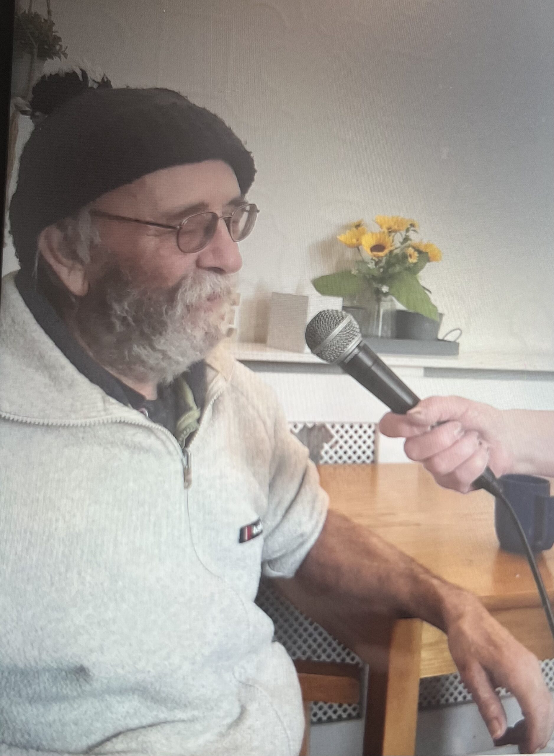 Alan showing of his lovely voice singing into a microphone scaled