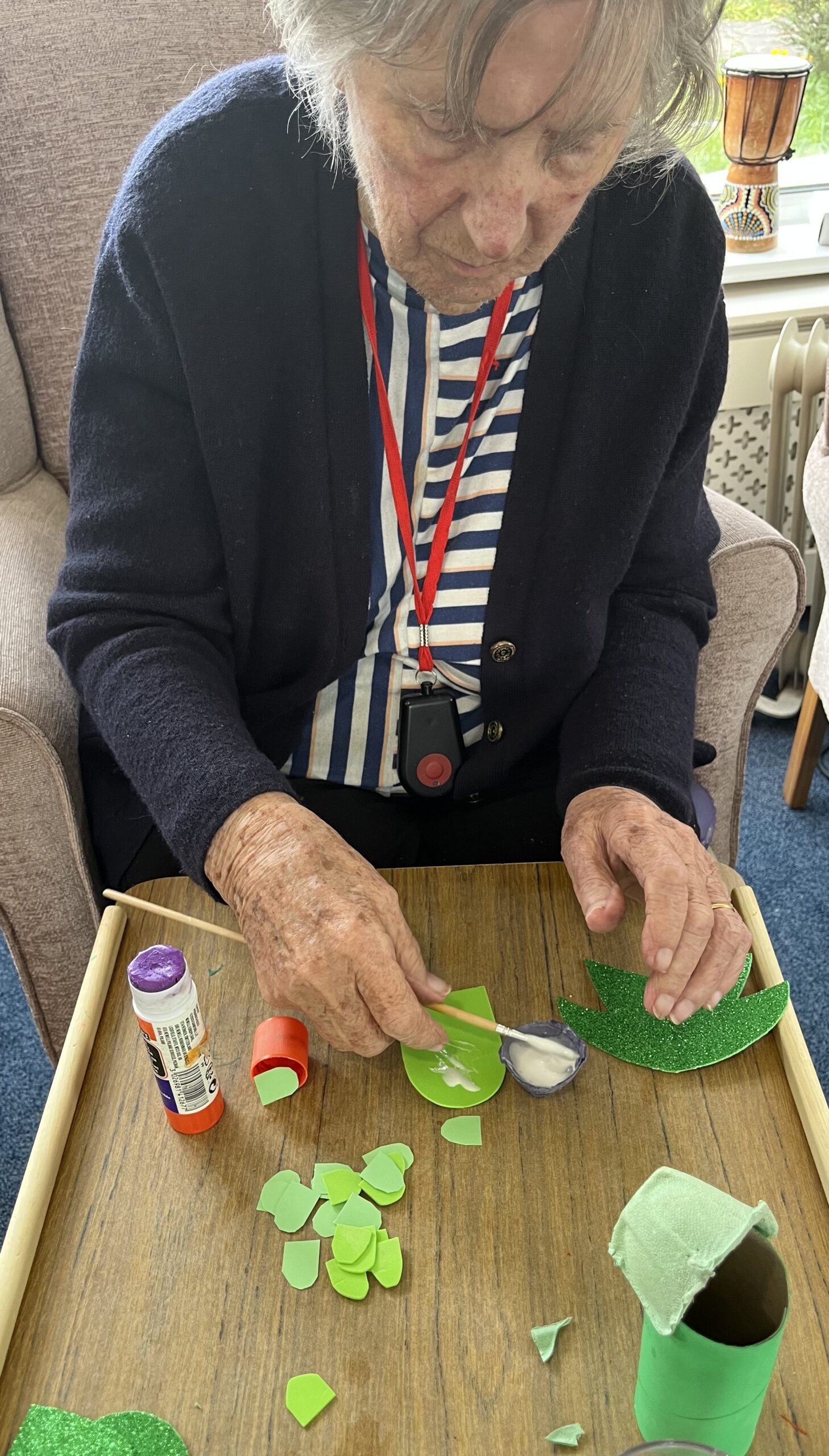 Barb gluing wings to her dragon