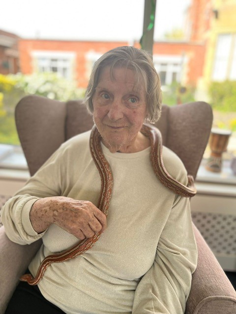 Barb with a snake around her neck