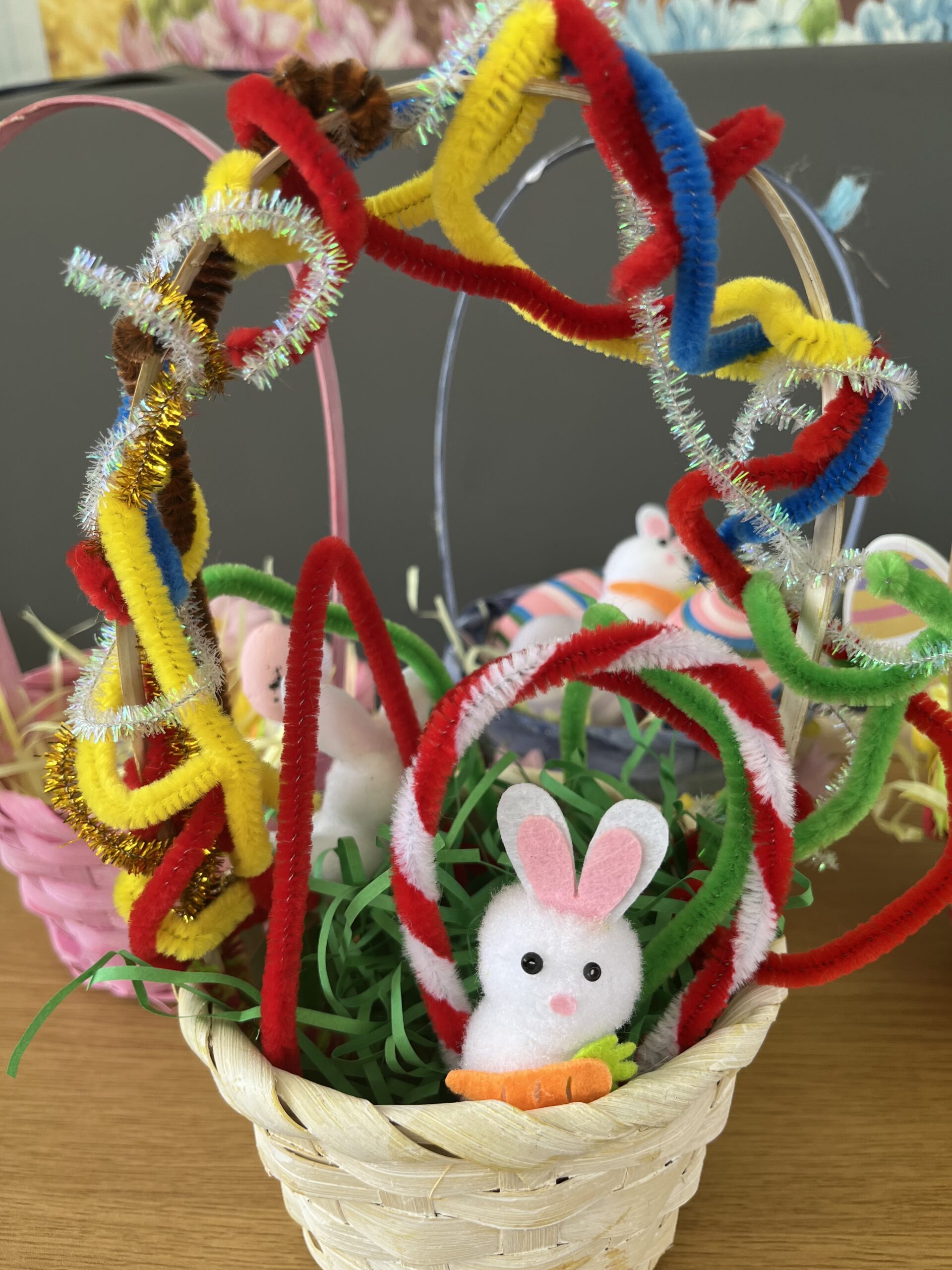 Barbs basket decorated with pipe cleaners Easter bunnies and green paper straw scaled