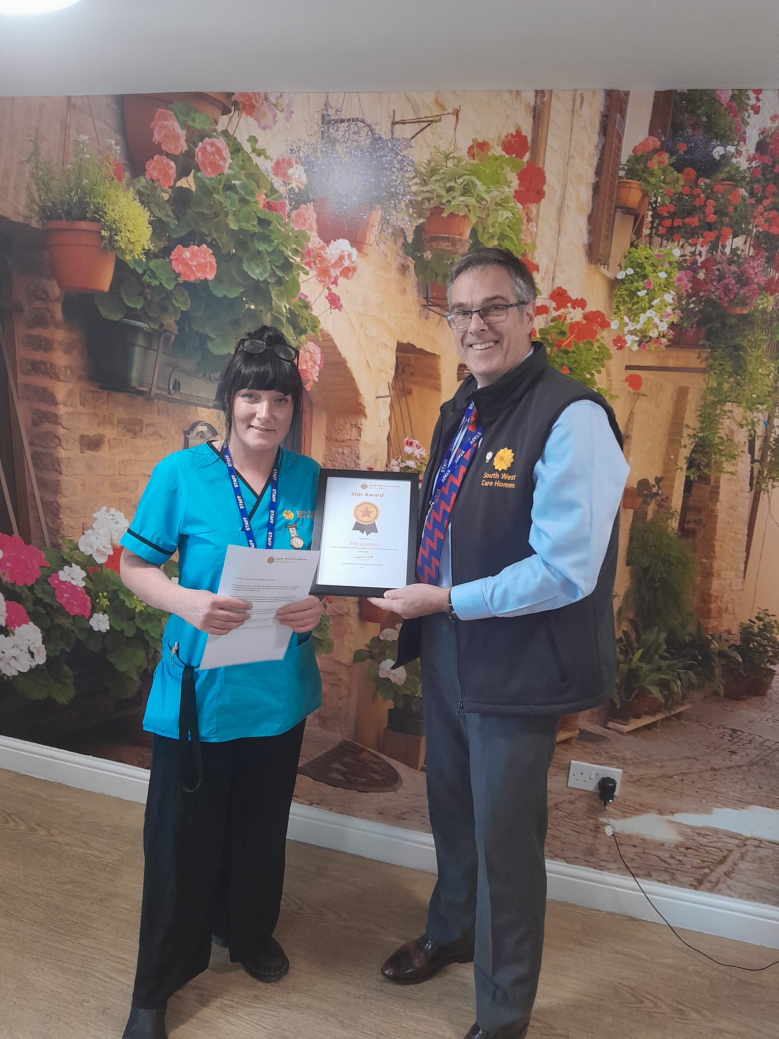 Billie Jo Kendall receiving framed Star Award from Richard White