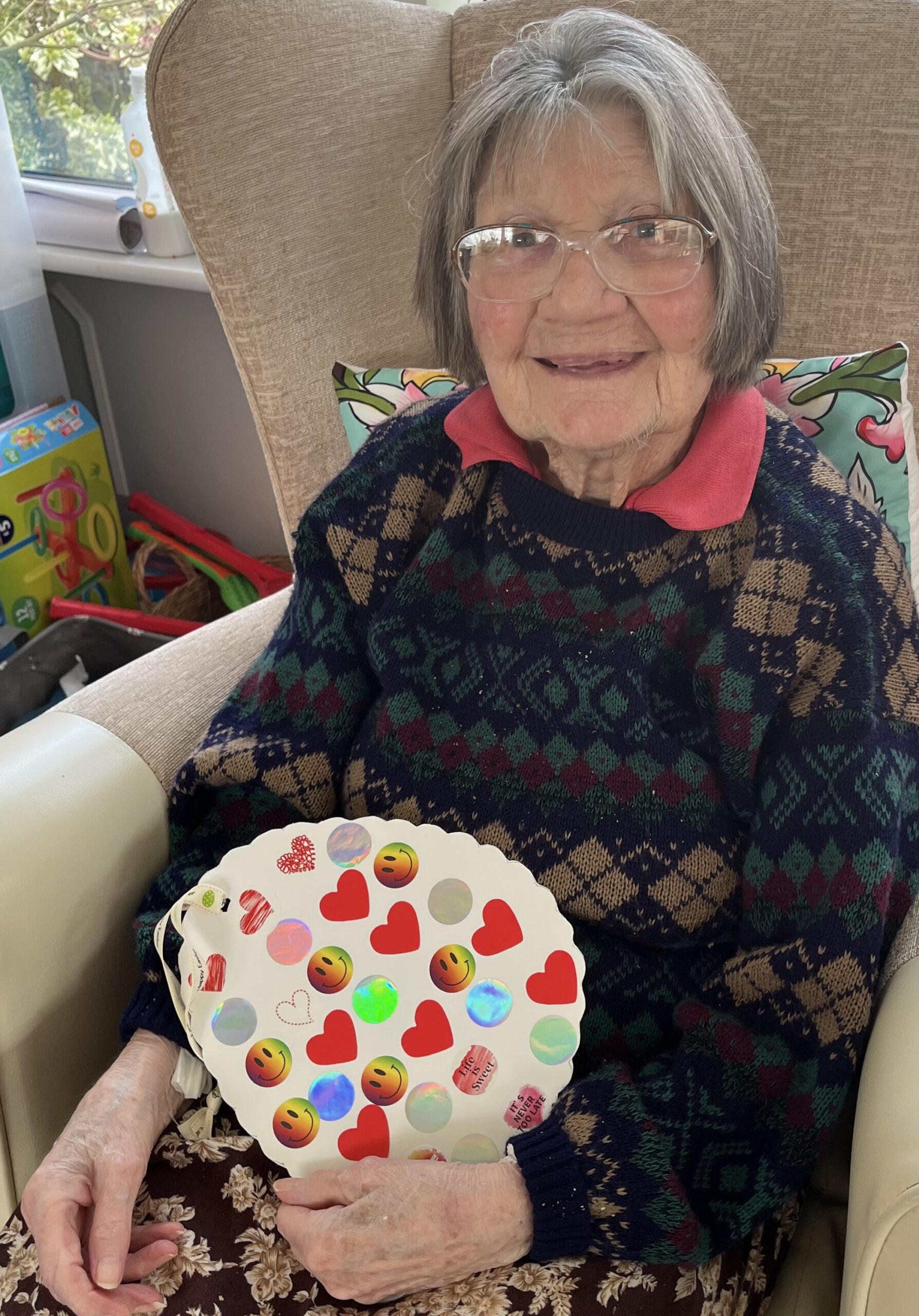 Eileen showing her decorated egg scaled