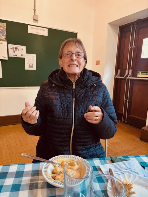 Female resident enjoying a bowl of crumble