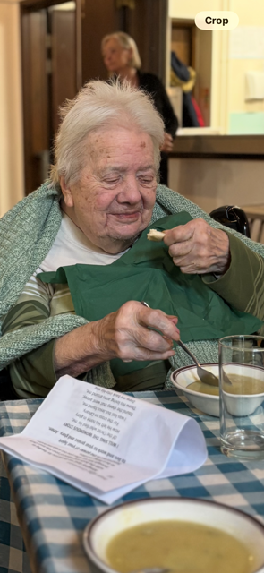 Female resident enjoying a bowl of soup