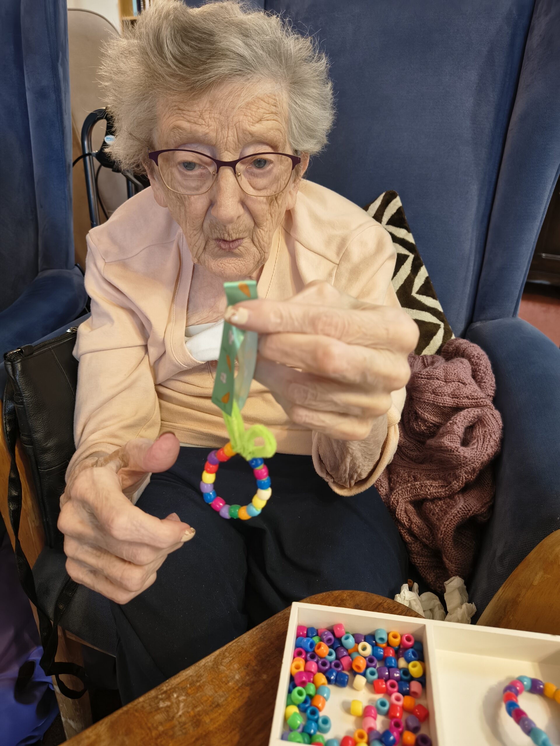 Female resident showing finished bead easter egg