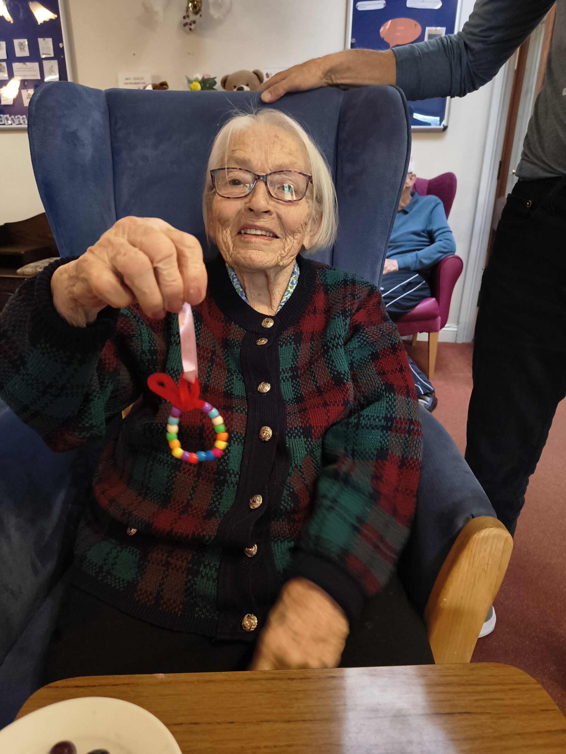 Female resident showing finished bead easter egg