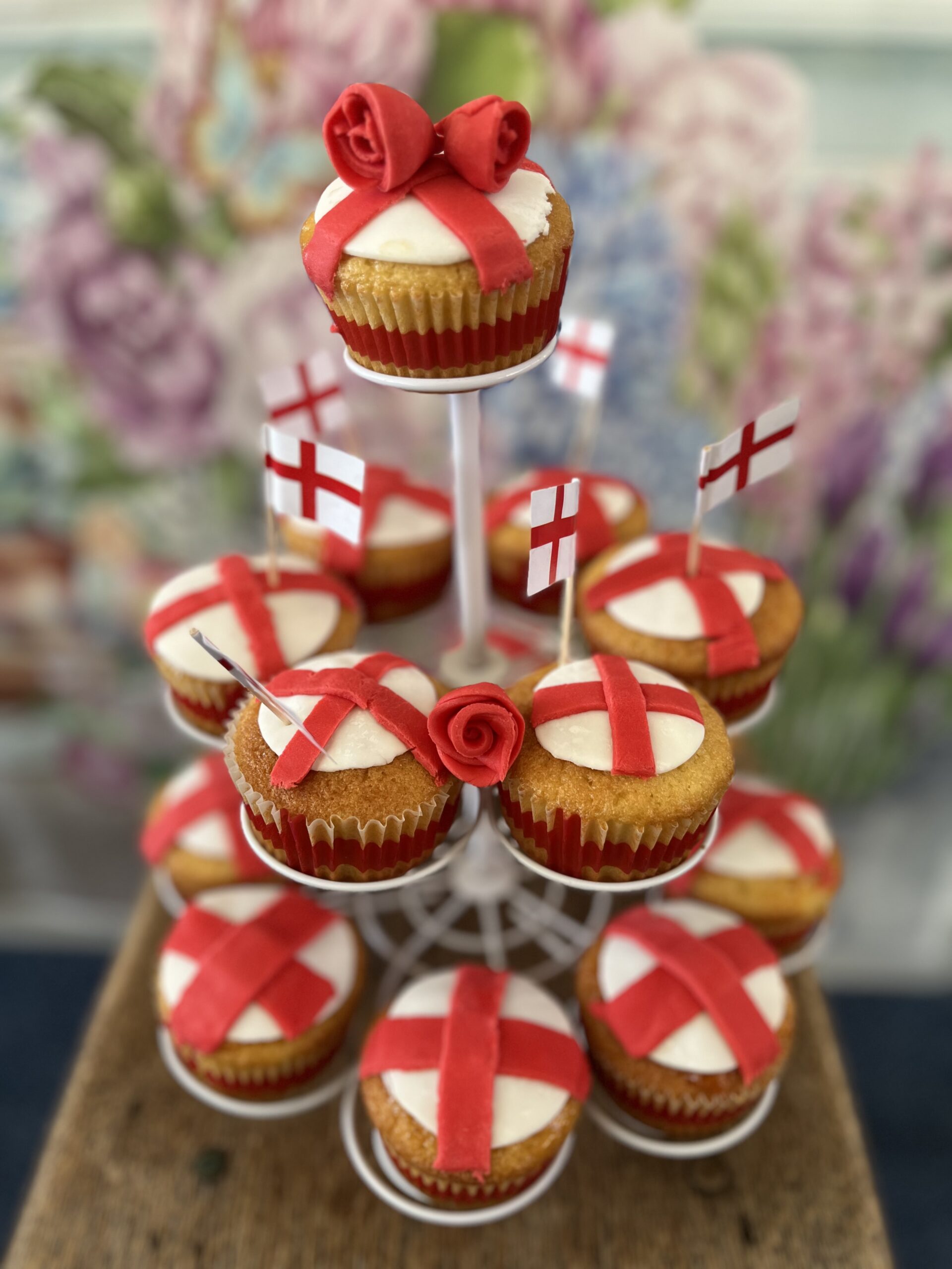 Finished cupcakes on a cake stand with mini England flags scaled