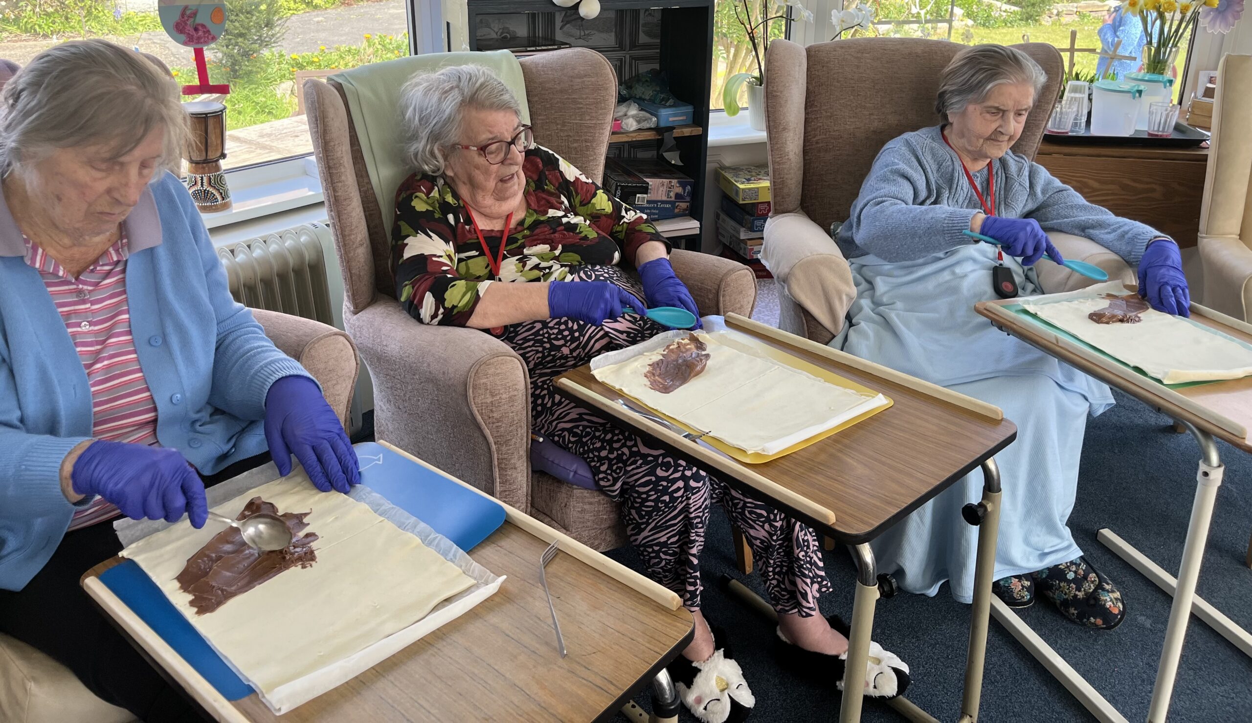 Ladies production line spreading chocolate
