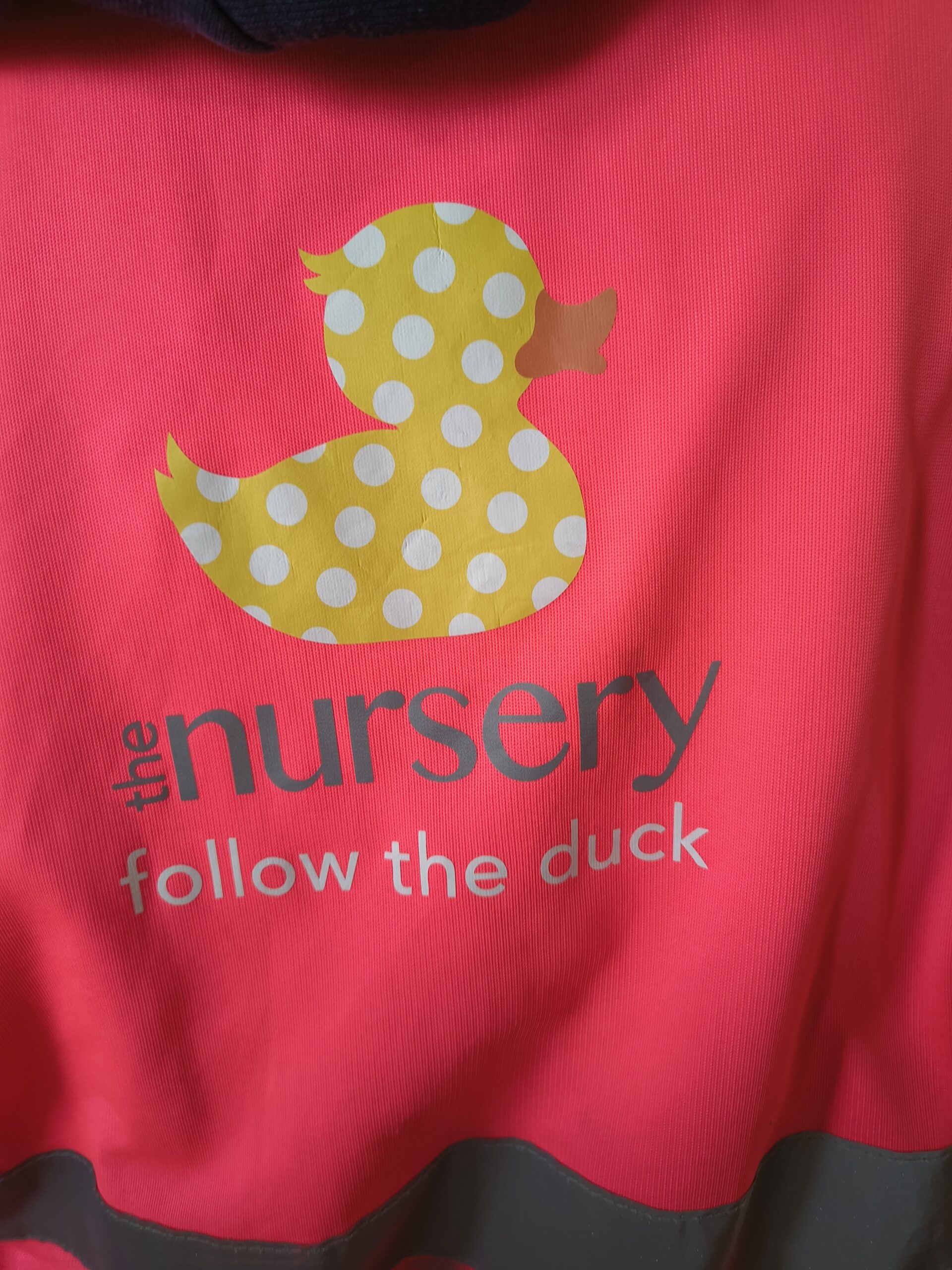 Logo printed on a cloth the nursery follow the duck scaled