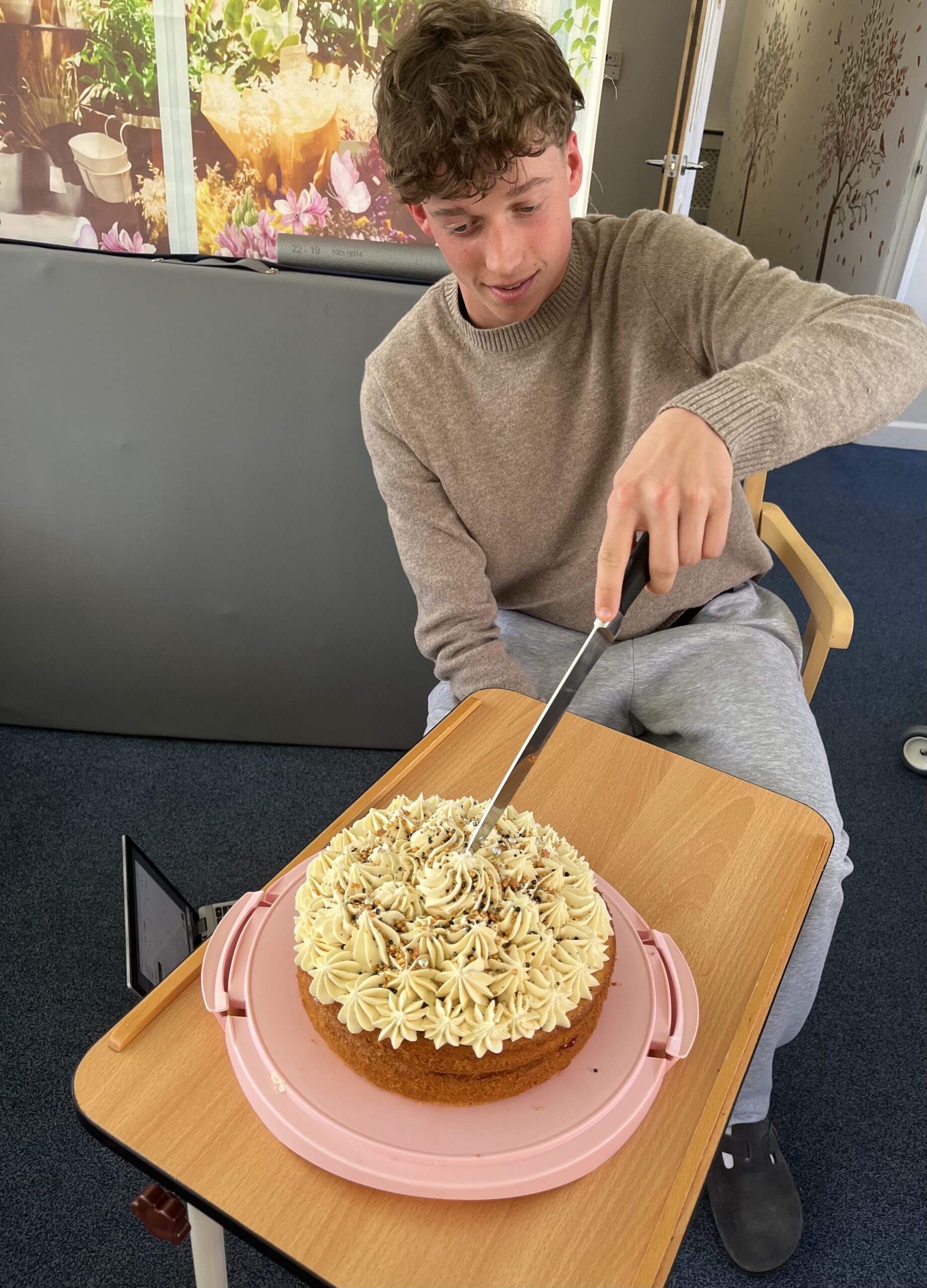 Luke cutting a cake scaled