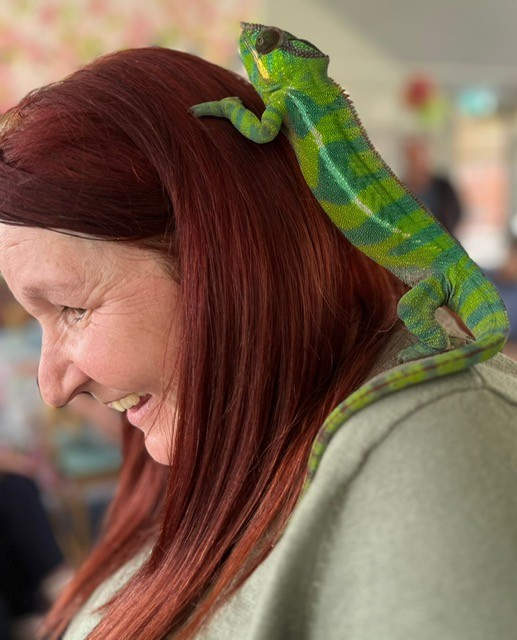 Manager Clare with Chameleon climbing on to her head