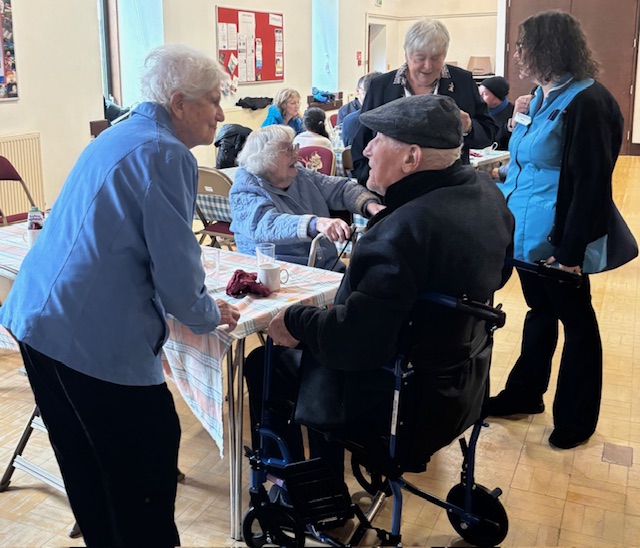 Pastor Kim talking with residents and carers
