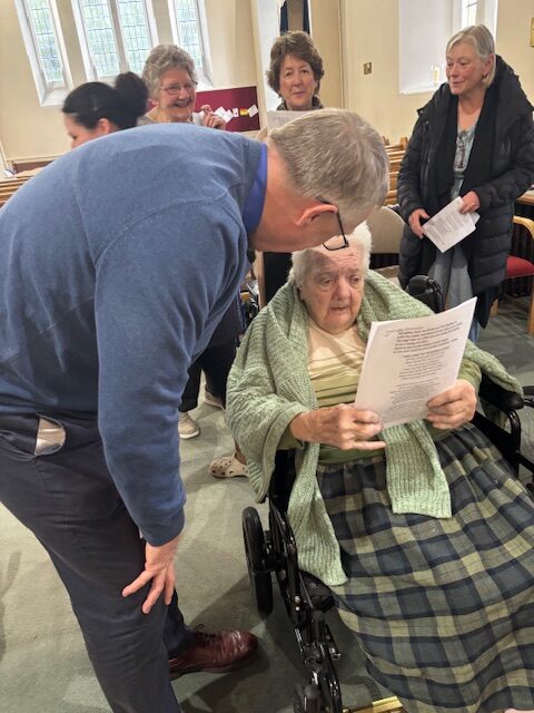 Resident speaking with a member of the church