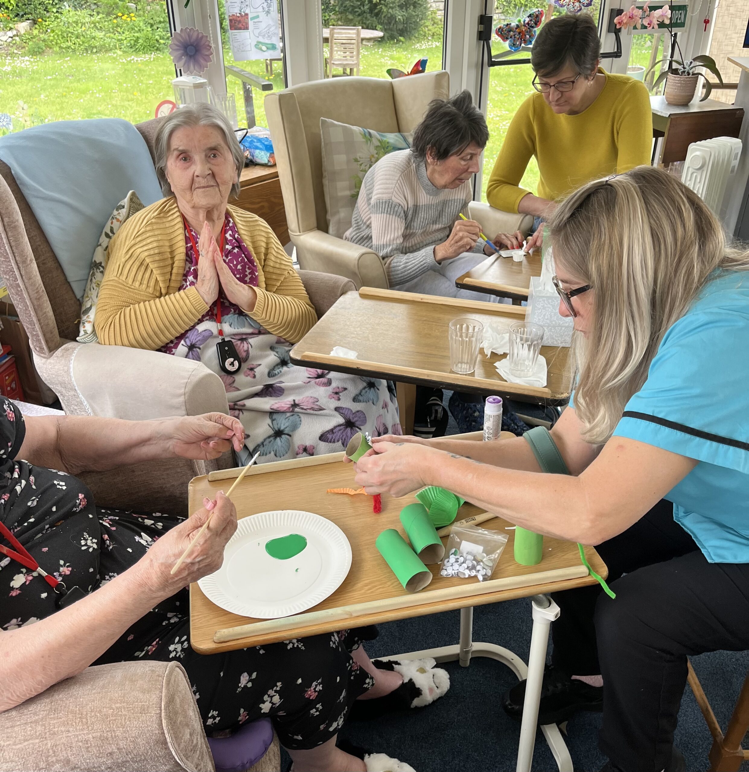 Residents and carers helping each other with the task