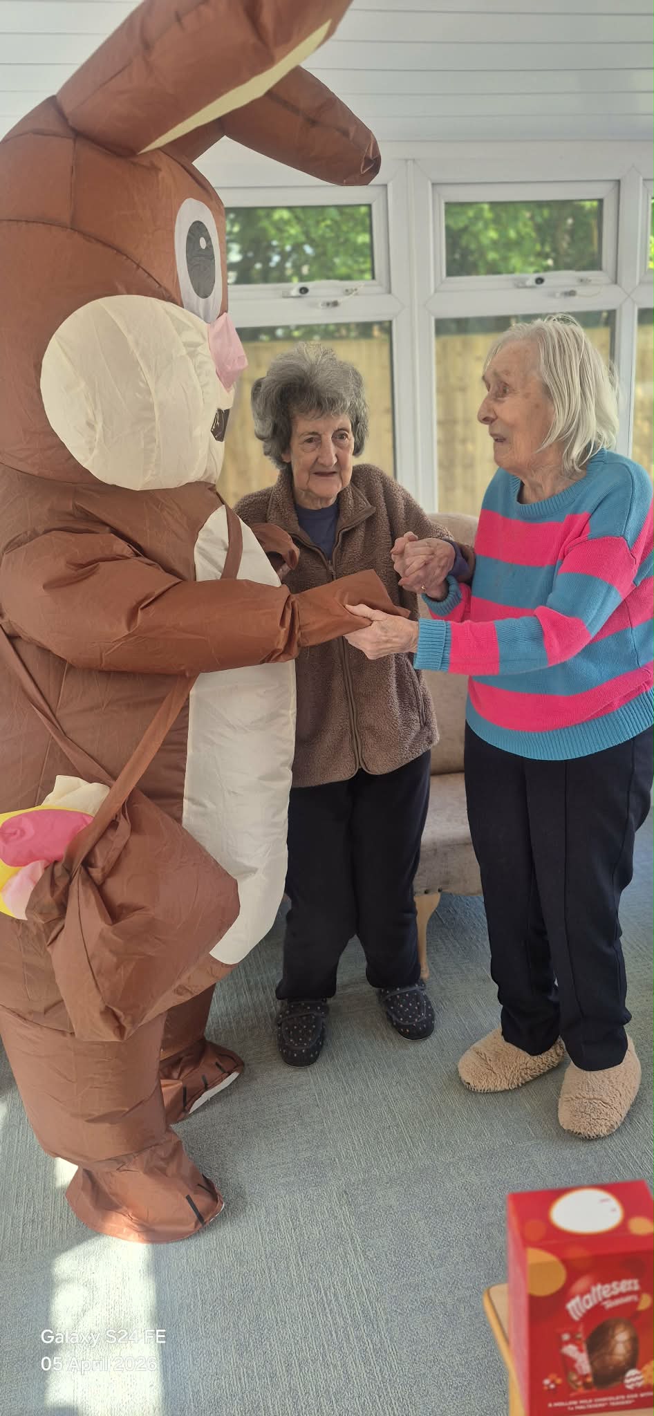 Residents dancing with the Easter bunny in the conservatory 2