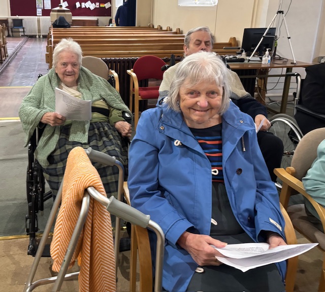 Residents seated together in St Pauls Church