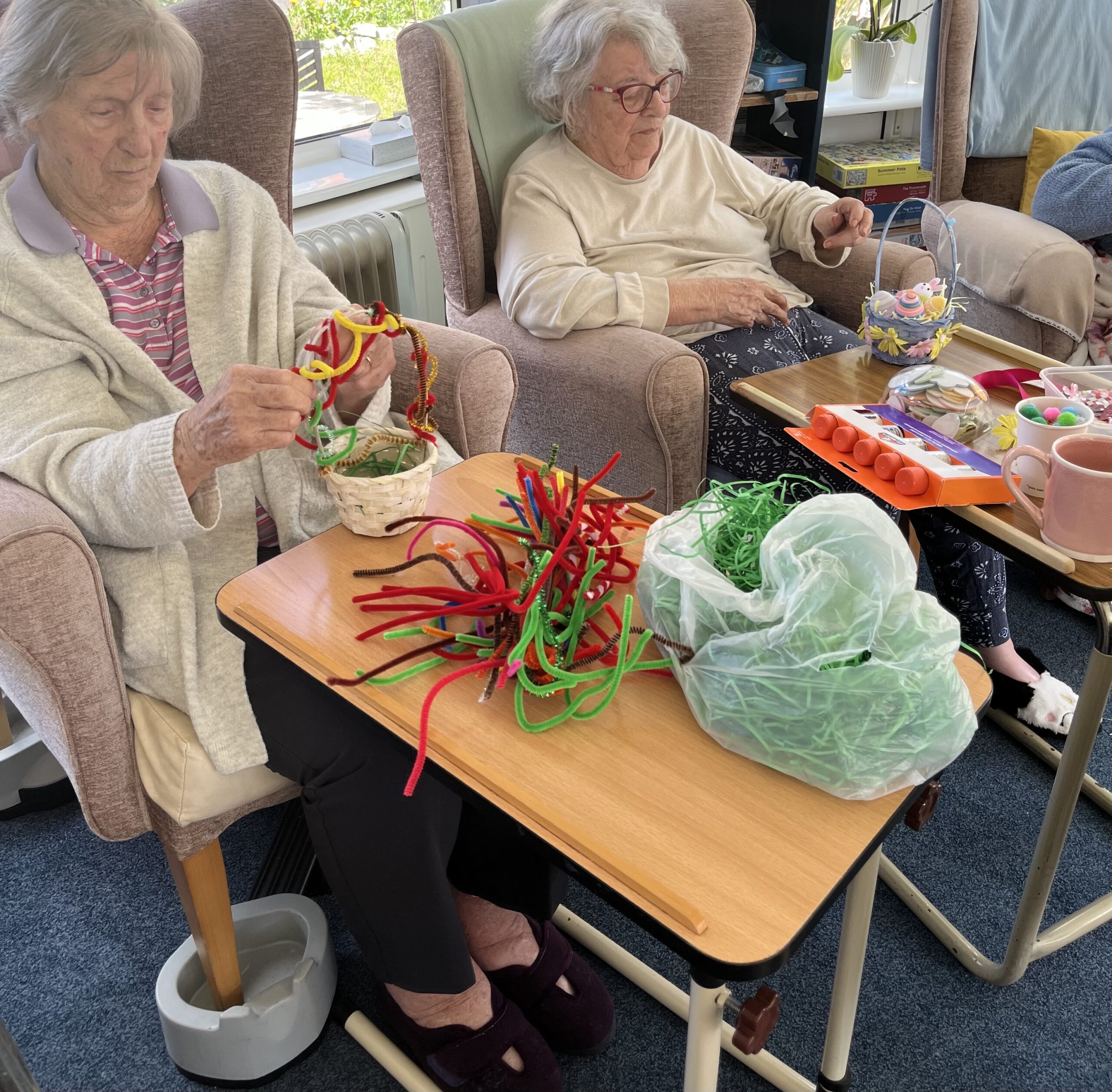 Residents wrapping their Easter basket handles with colourful pipe cleaners and Easter decorations scaled