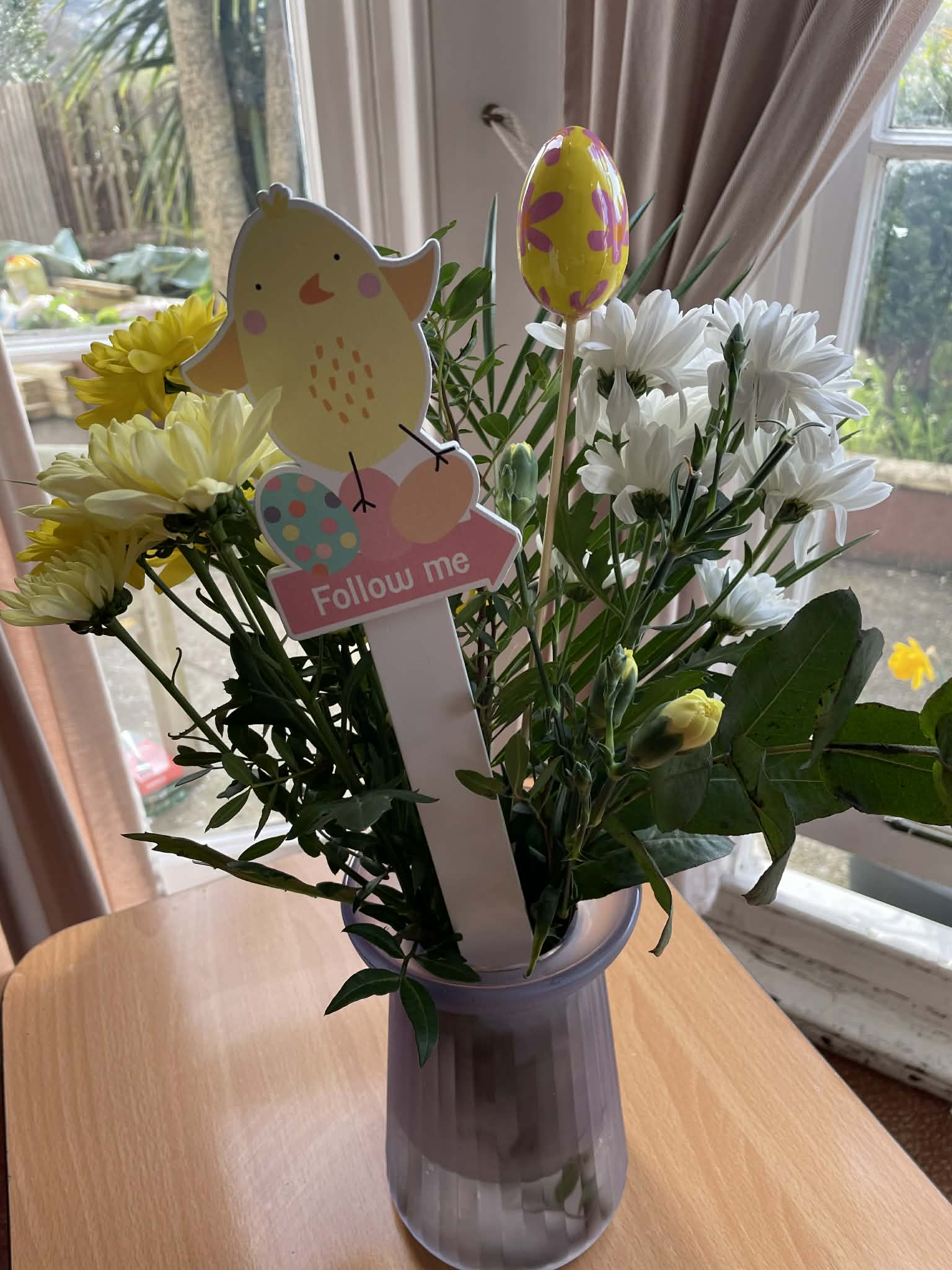 Vase of flowers with Easter decorations