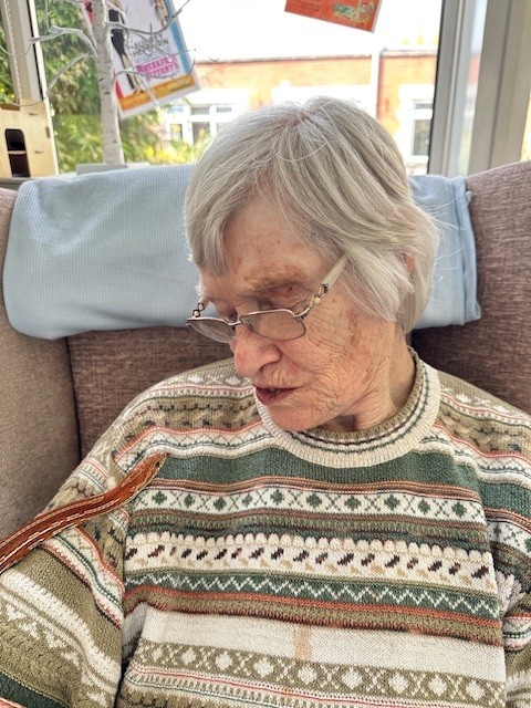 Wendy with a snake sliding up her arm