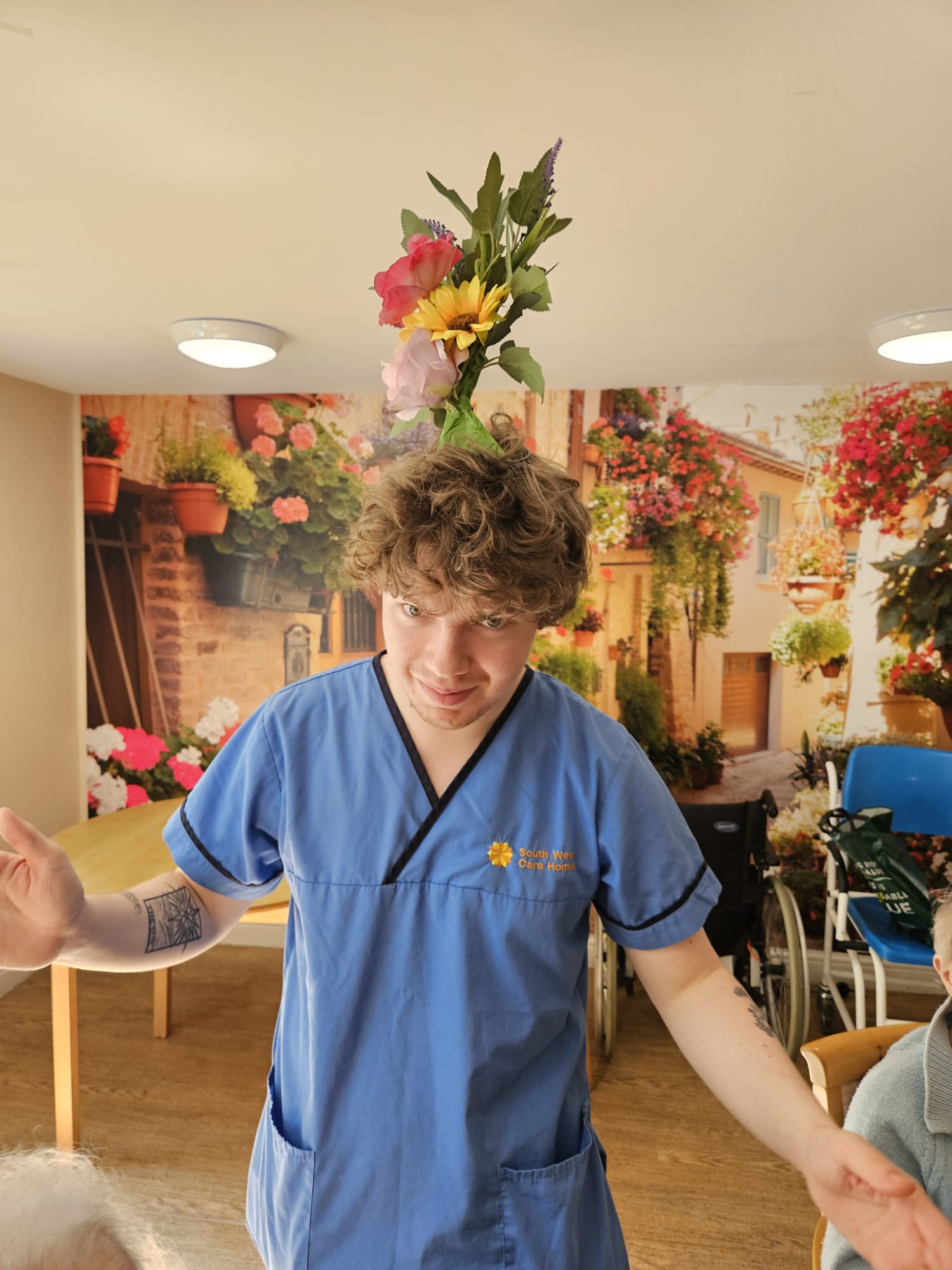 Carer Owen with a finished wreath on his head!