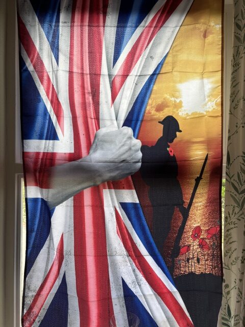 Fabric picture of the Union Jack with a soldier and poppy