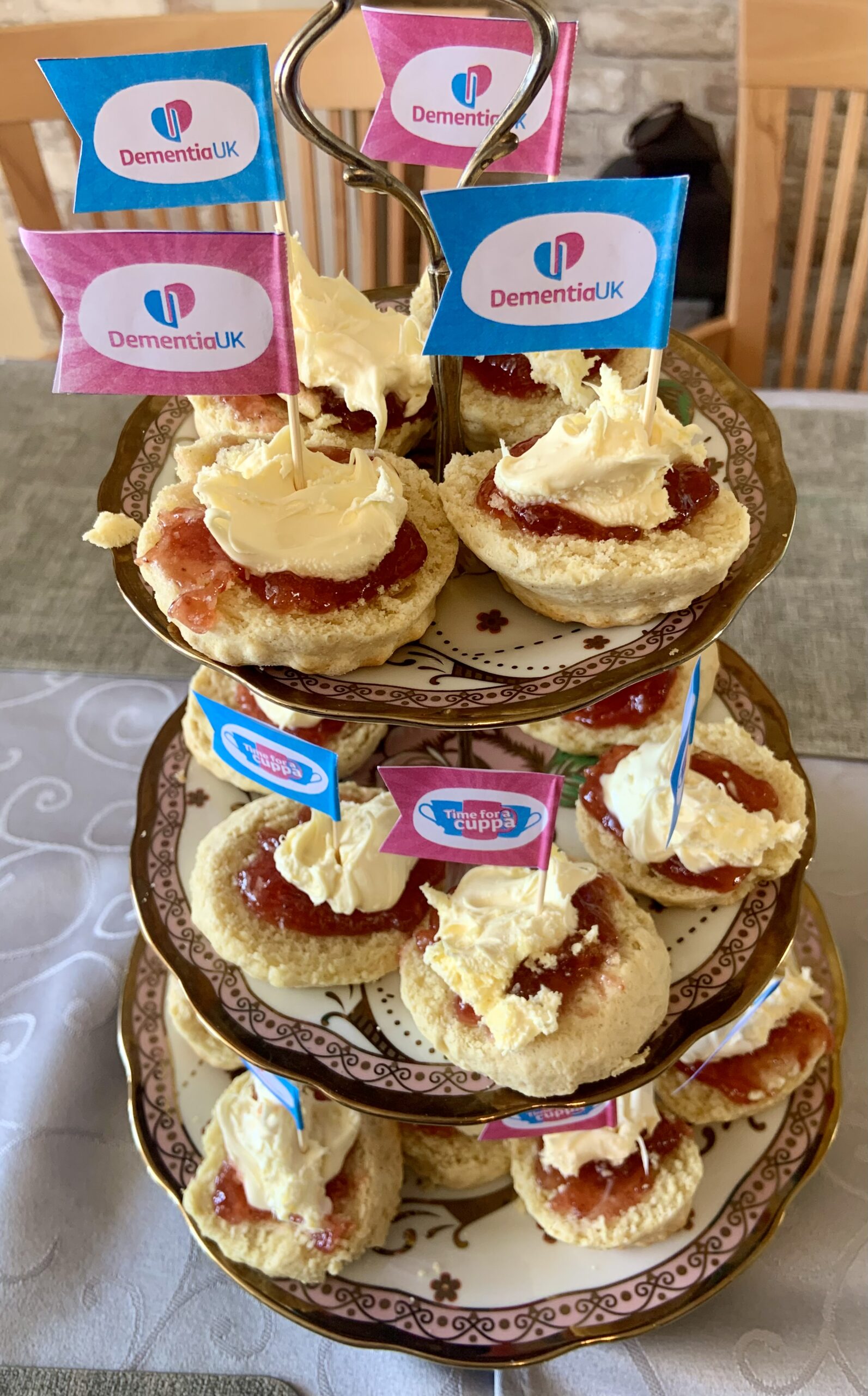 Jam and cream scones arranged on a 3-tier cake stand